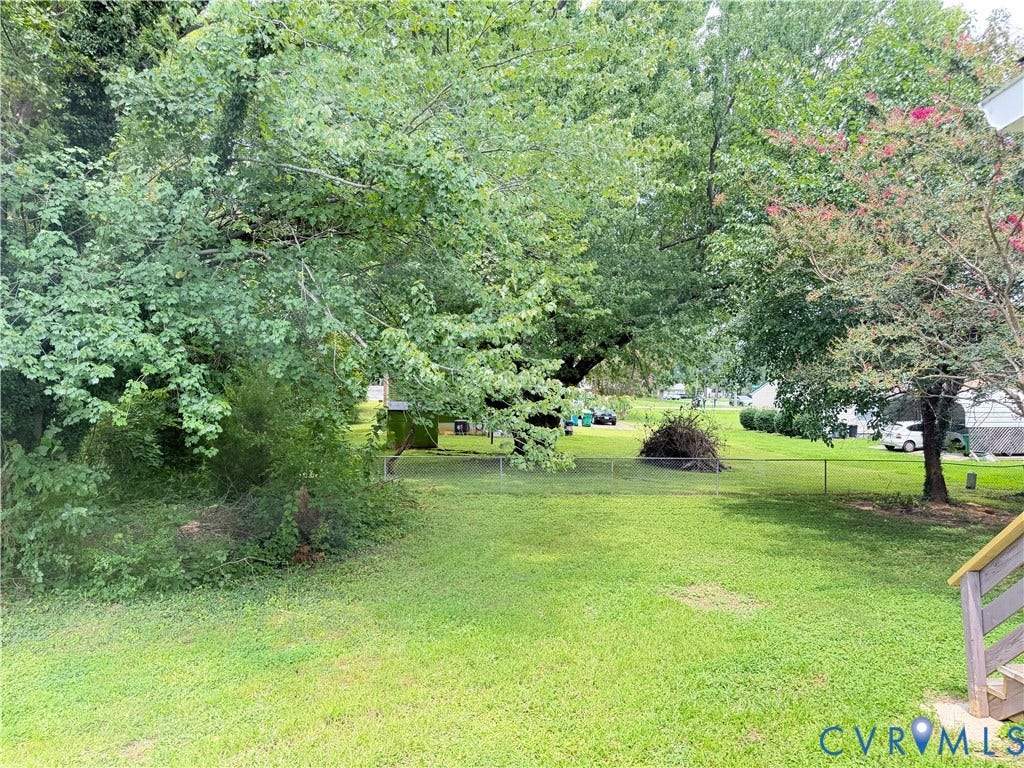 1308 Bentbrook Drive, Henrico, VA 23231 Expansive green lawn with mature trees and perimeter fencing