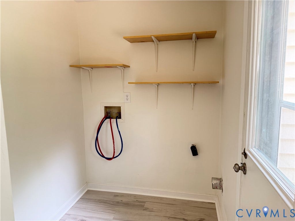 1308 Bentbrook Drive, Henrico, VA 23231 Utility area featuring wood-finish flooring, three mounted storage shelves, and a windowed exterior door