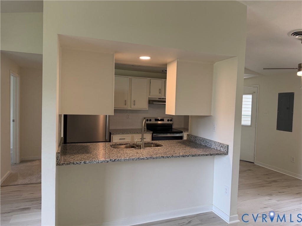 1308 Bentbrook Drive, Henrico, VA 23231 Kitchen featuring white cabinetry, granite countertops, stainless steel sink with a gooseneck faucet, and a tile backsplash