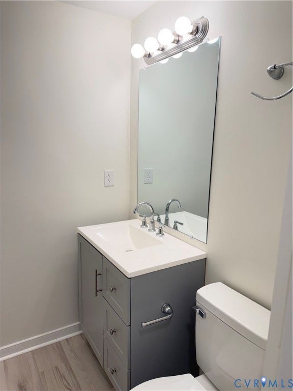 1308 Bentbrook Drive, Henrico, VA 23231 Bathroom vanity featuring a light gray cabinet with brushed nickel hardware, an integrated sink, and a white countertop