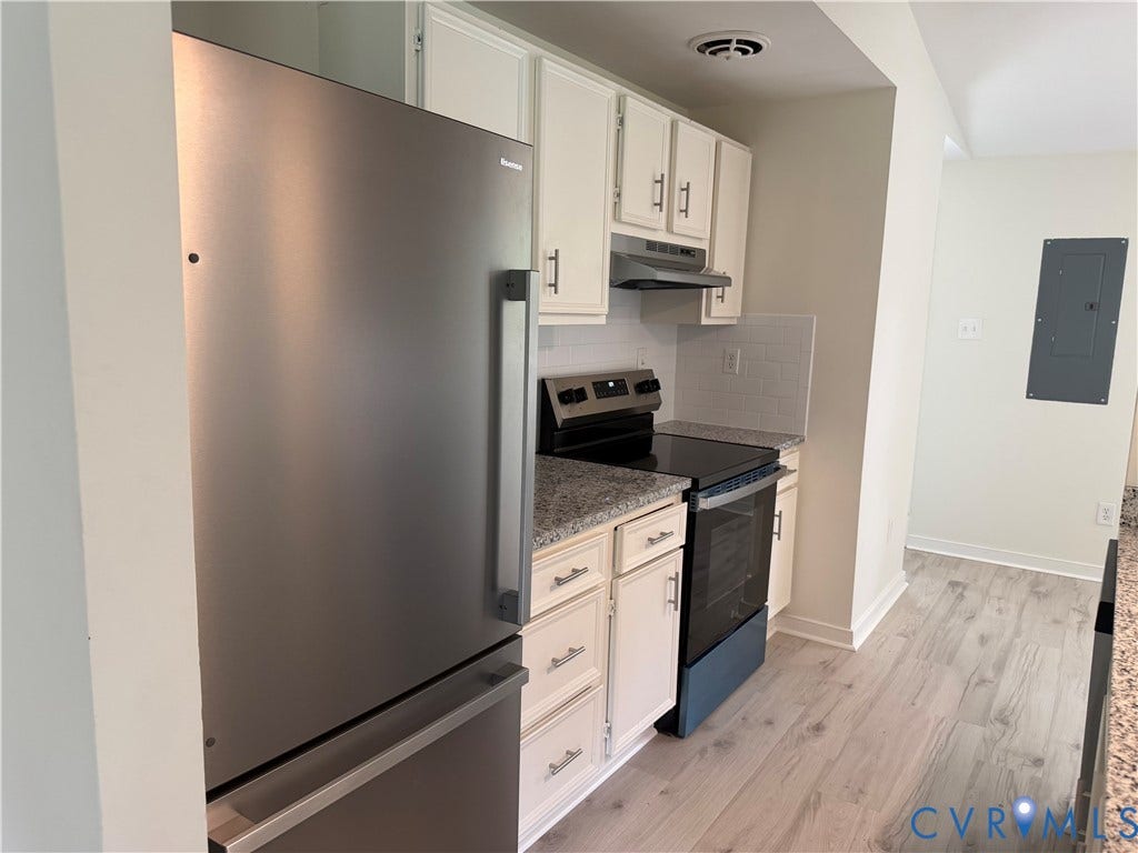 1308 Bentbrook Drive, Henrico, VA 23231 Kitchen featuring stainless steel appliances, white cabinetry with T-bar pulls, granite-finish countertops, subway tile backsplash, and light wood-finish flooring