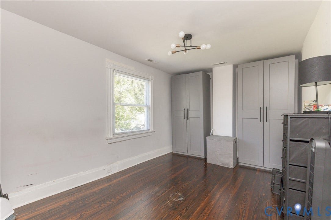 716 E Gladstone Avenue, Richmond, VA 23222 Hardwood flooring, built-in storage units, recessed window, and a contemporary ceiling fixture