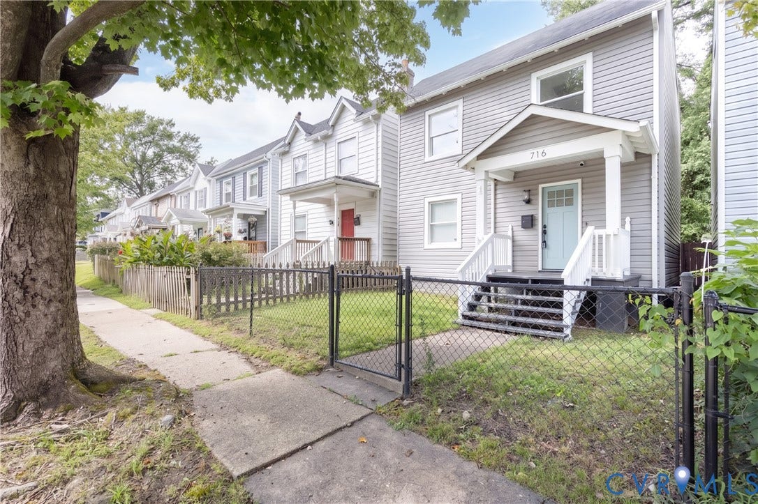 716 E Gladstone Avenue, Richmond, VA 23222 Vinyl siding exterior featuring a covered porch with white railing