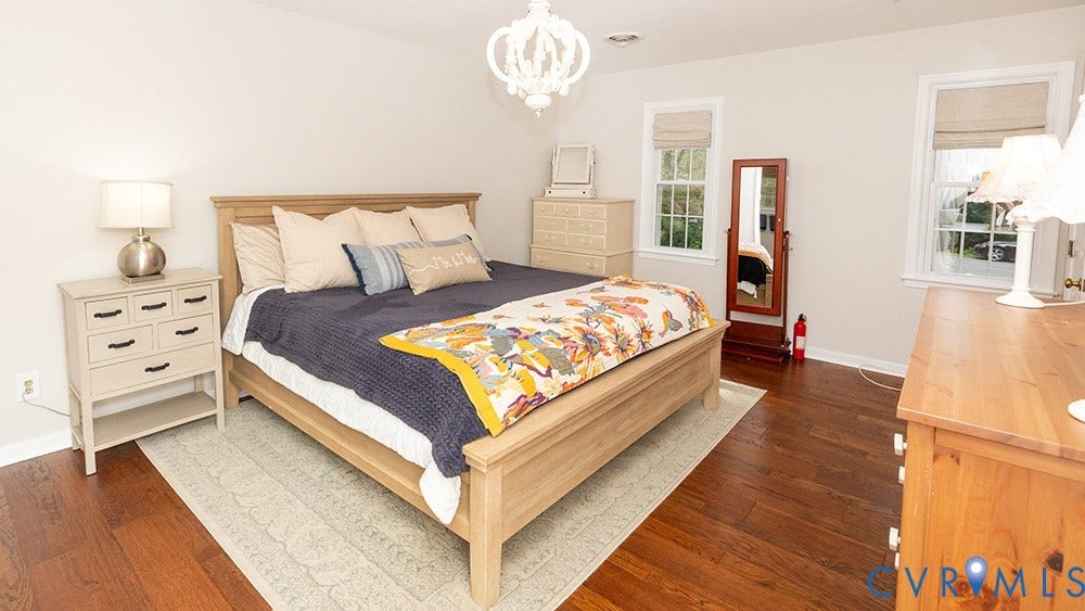 419 Rossmere Drive, Walton Park, Midlothian, VA 23114 Bedroom featuring dark wood-finish flooring, light-colored walls, and a decorative white chandelier