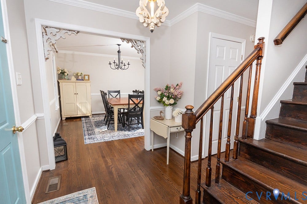 419 Rossmere Drive, Walton Park, Midlothian, VA 23114 Entry foyer featuring wood-finish flooring, staircase with wood banister, and decorative trim