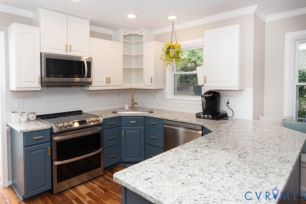 419 Rossmere Drive, Walton Park, Midlothian, VA 23114 Spacious kitchen featuring two-tone cabinetry with gold-tone hardware, stainless steel appliances, speckled stone countertops, and subway tile backsplash