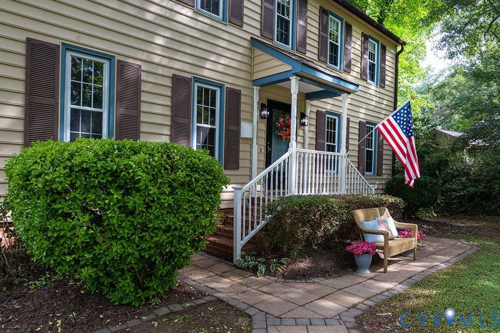 419 Rossmere Drive, Walton Park, Midlothian, VA 23114 Classic Colonial-style residence featuring horizontal siding and dark louvered shutters