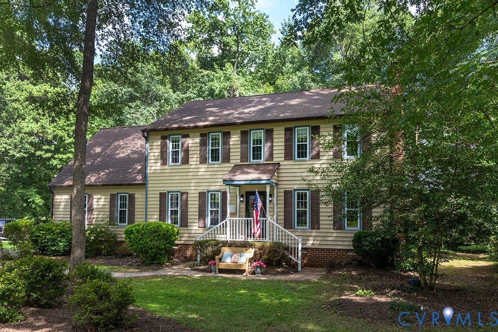 419 Rossmere Drive, Walton Park, Midlothian, VA 23114 Traditional-style home featuring horizontal siding, a covered entry porch with white railings, and a mature tree canopy