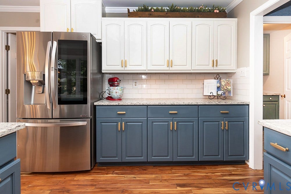 419 Rossmere Drive, Walton Park, Midlothian, VA 23114 Kitchen featuring wood-finish flooring, two-tone cabinetry with gold-tone hardware, a subway tile backsplash, and light-colored countertops