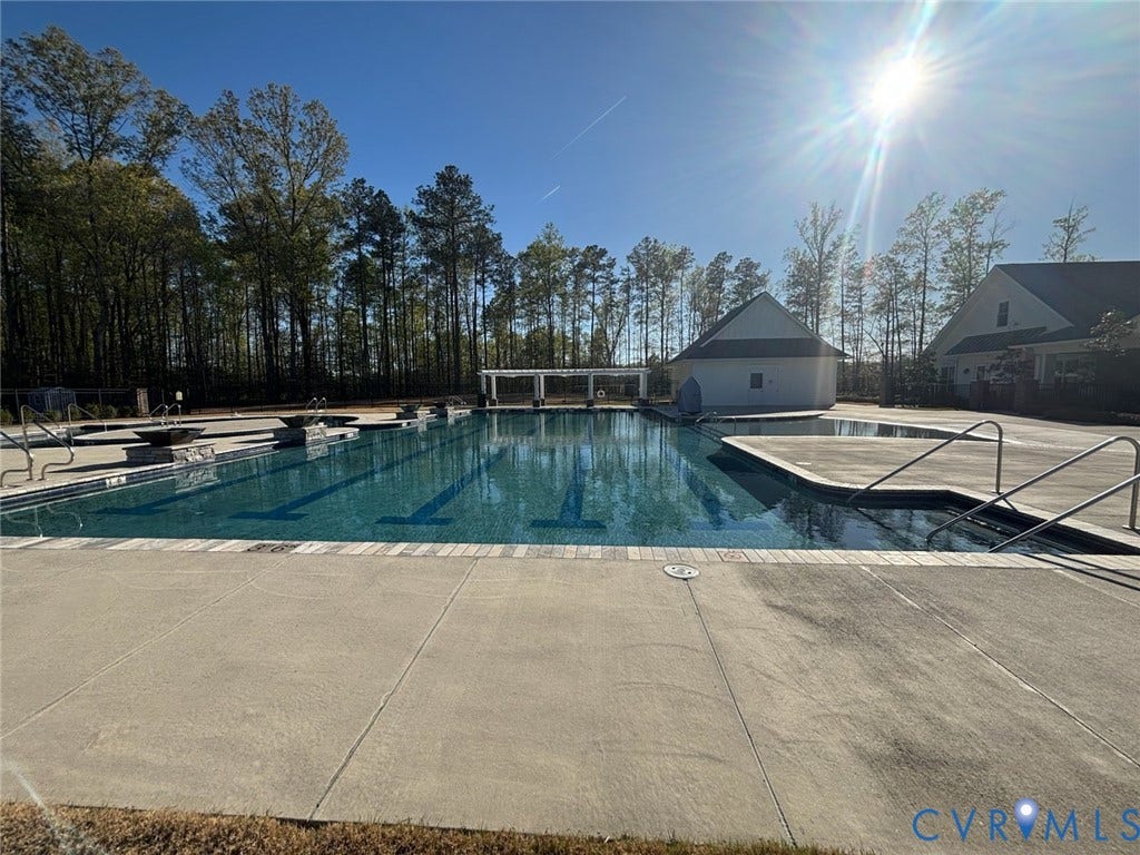 7484 Southamptonshire Way, Autumn Pines, New Kent, VA 23124 Community swimming pool featuring a concrete deck and multiple entry points