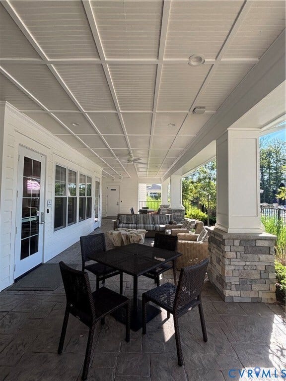 7484 Southamptonshire Way, Autumn Pines, New Kent, VA 23124 Expansive covered patio featuring a coffered ceiling, recessed lighting, and a ceiling fan