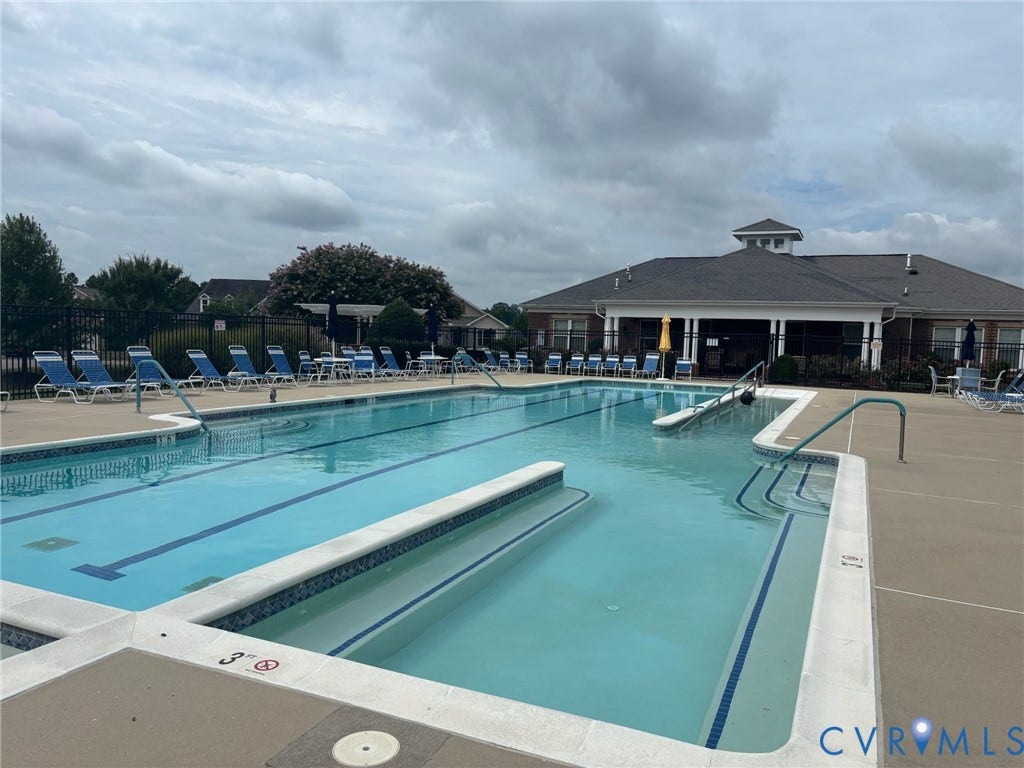 7484 Southamptonshire Way, Autumn Pines, New Kent, VA 23124 Community swimming pool featuring a lap lane, built-in steps, and a gradual entry ramp