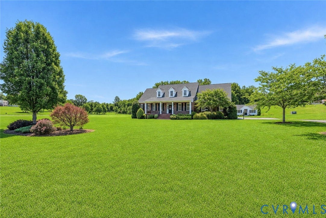 16225 Parrish Farms Road, Montpelier, VA 23192 Expansive green lawn with mature trees and landscaping surrounding a brick residence featuring a covered front porch and dormer windows