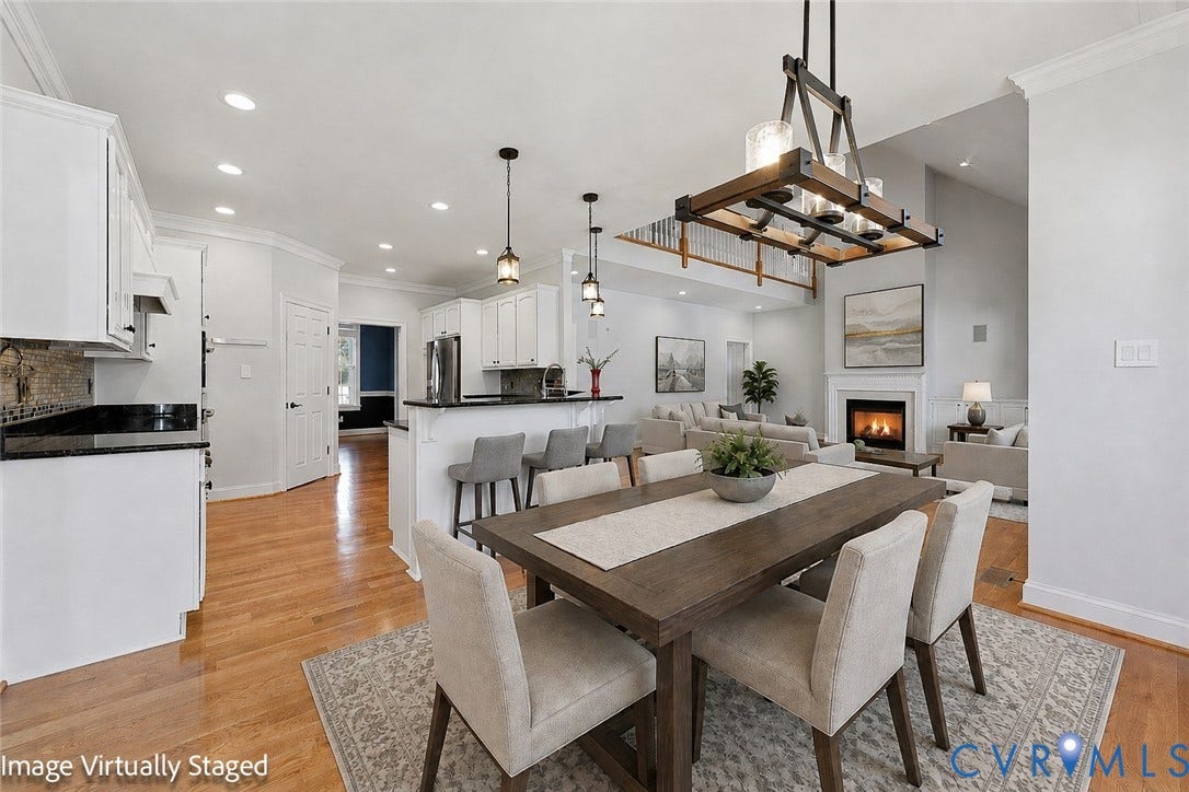 16225 Parrish Farms Road, Montpelier, VA 23192 Open-concept design featuring wood-finish flooring, a kitchen with white cabinetry and dark countertops, and a living area with a fireplace