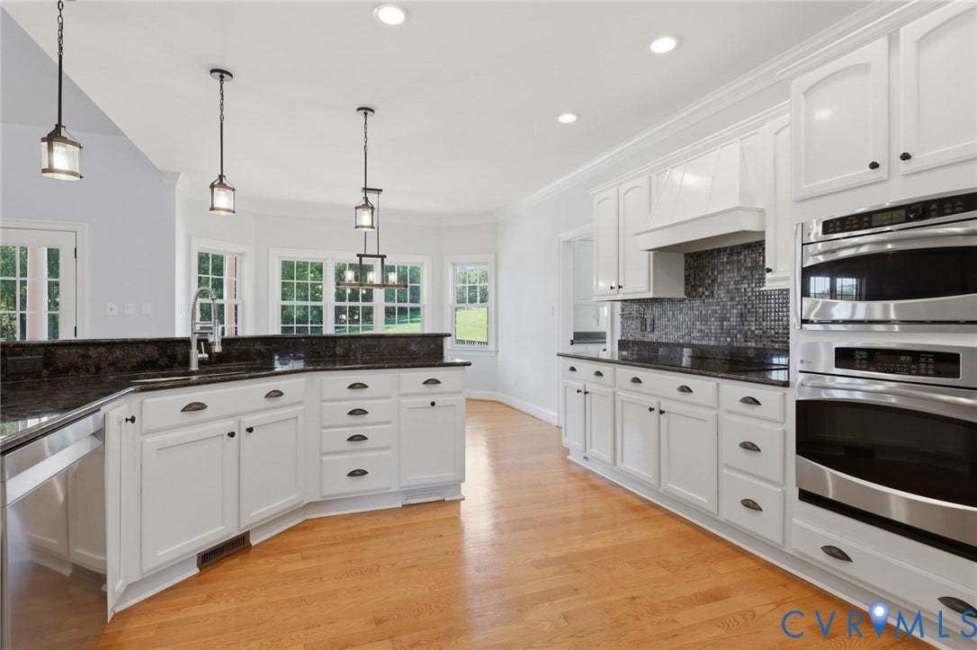 16225 Parrish Farms Road, Montpelier, VA 23192 Spacious kitchen featuring light wood-finish flooring and white cabinetry