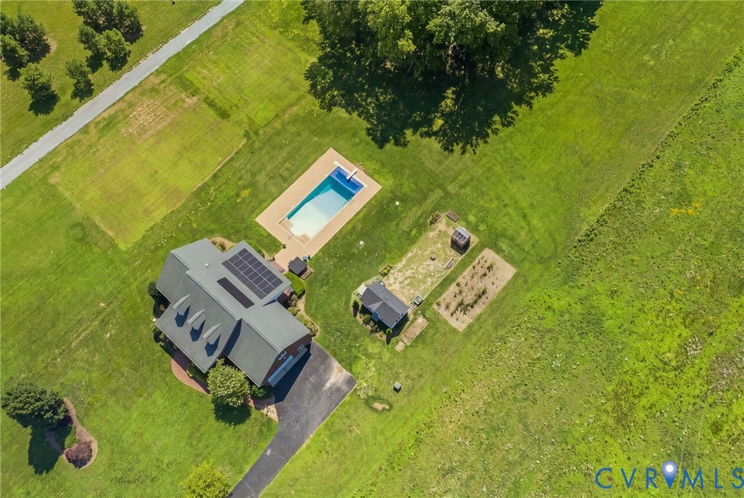 16225 Parrish Farms Road, Montpelier, VA 23192 Aerial perspective of a property featuring a rectangular swimming pool with a surrounding paved deck