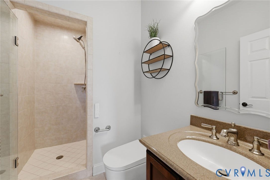 16225 Parrish Farms Road, Montpelier, VA 23192 Guest Bathroom first floor Walk-in shower with light-toned tile surround and glass enclosure