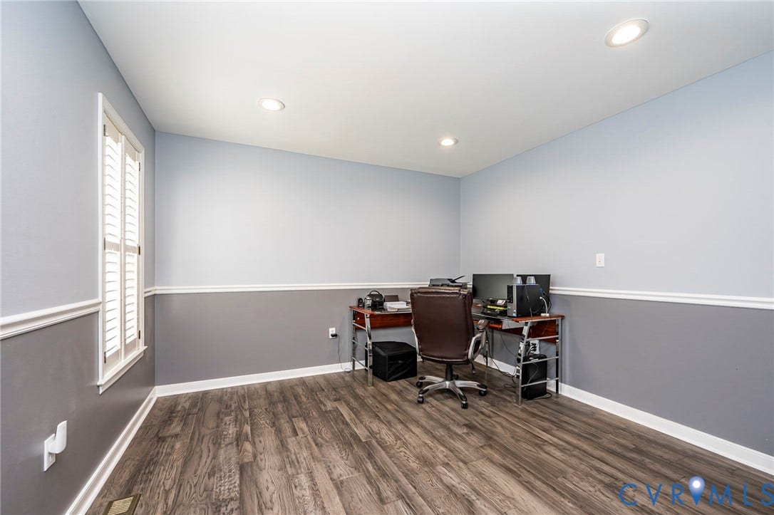 11821 Park Forest Way, Glen Allen, VA 23059 Spacious interior room featuring wood-finish flooring, two-tone wall paint, white trim, and a window with white louvered shutters