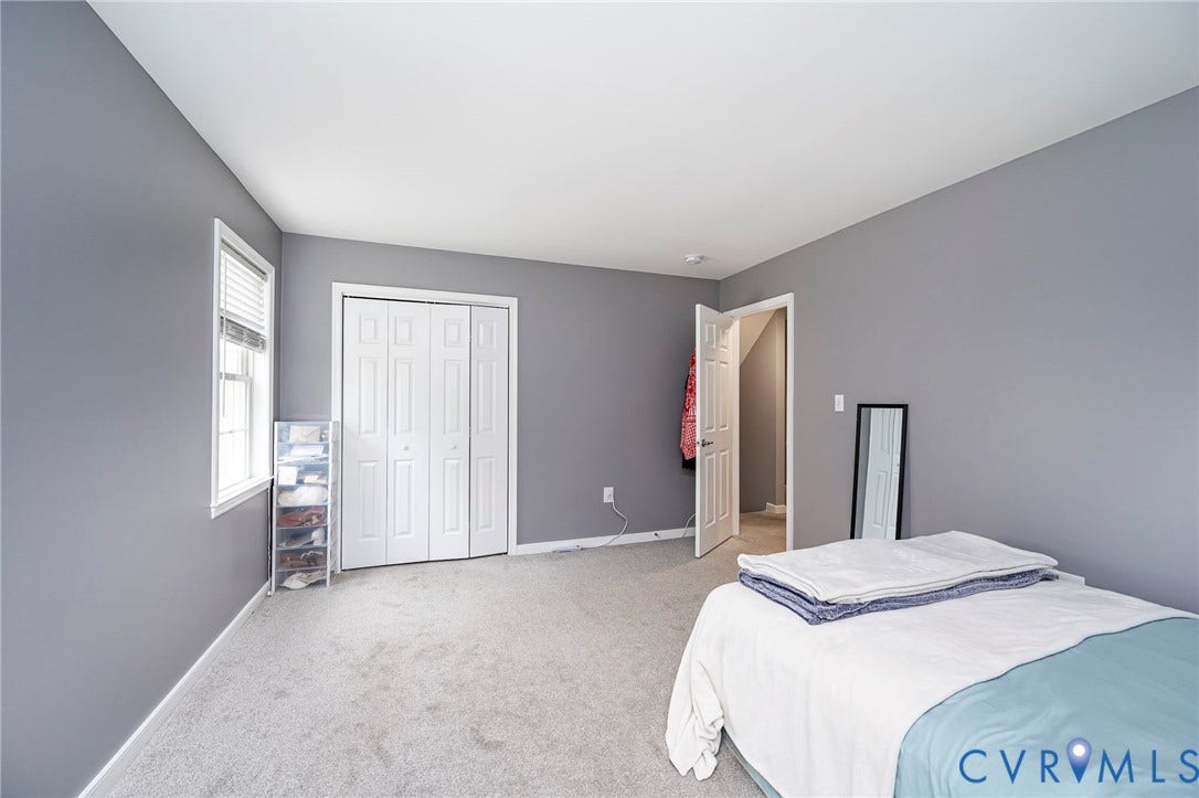 11821 Park Forest Way, Glen Allen, VA 23059 Carpeted room featuring a white bi-fold closet, a window with blinds, and neutral grey wall paint
