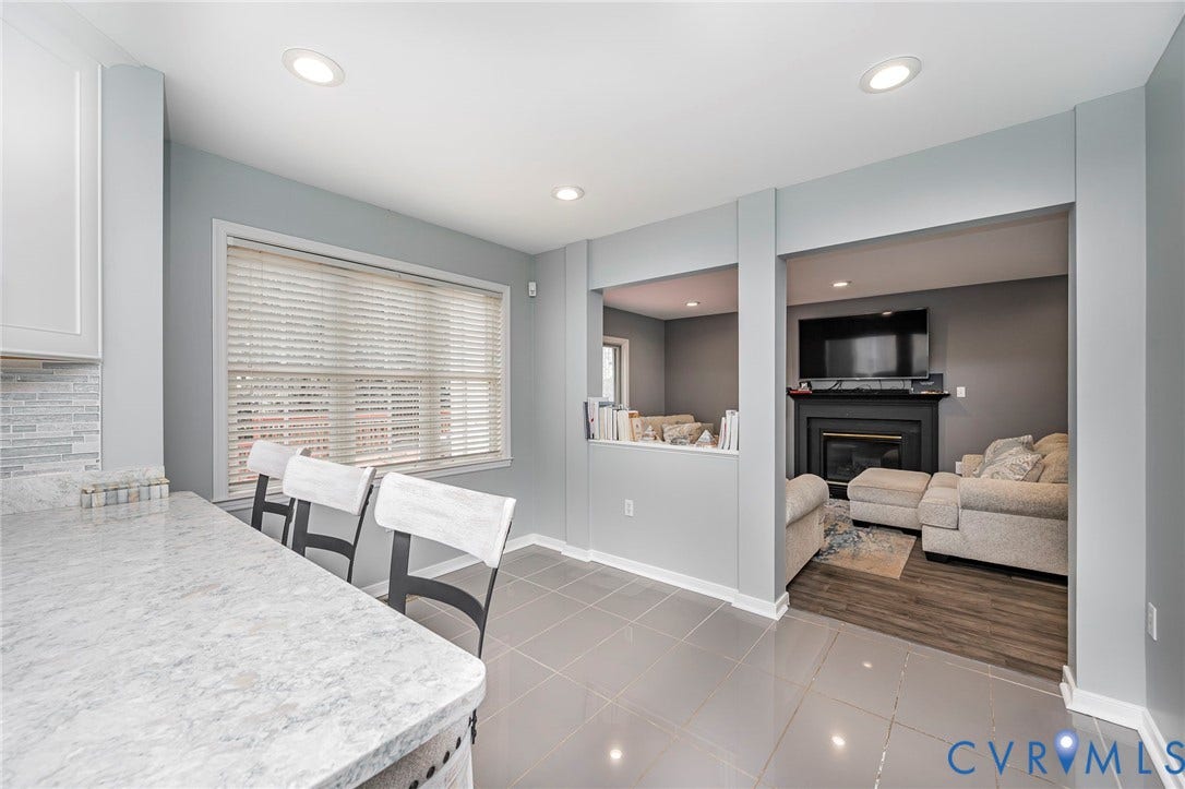 11821 Park Forest Way, Glen Allen, VA 23059 Kitchen counter seating area with recessed lighting and a tile backsplash