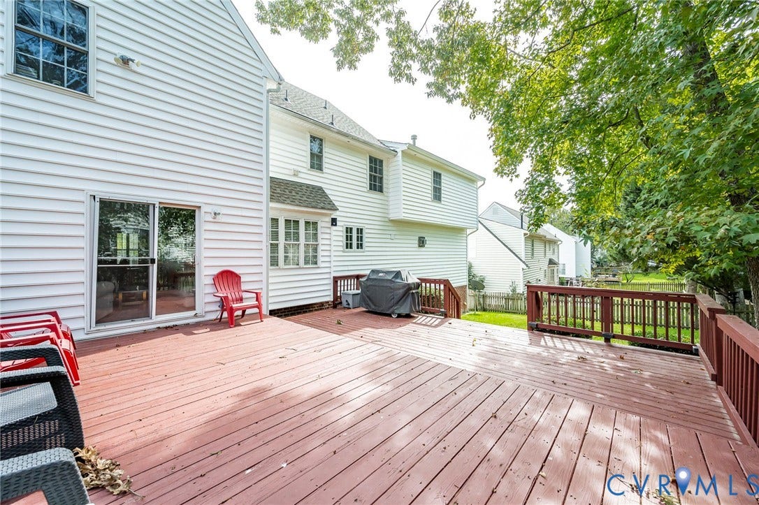 11821 Park Forest Way, Glen Allen, VA 23059 Expansive wood deck featuring a rich red-brown finish and perimeter railing
