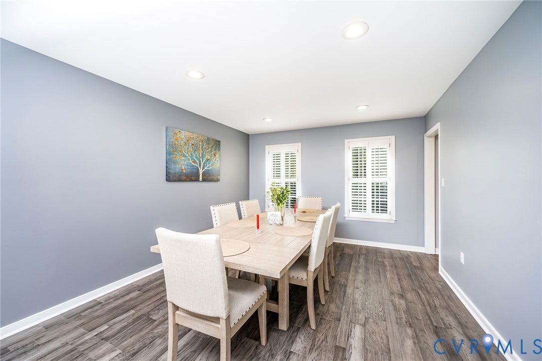 11821 Park Forest Way, Glen Allen, VA 23059 Dining area featuring gray wood-finish flooring, recessed lighting, and two windows with white plantation shutters