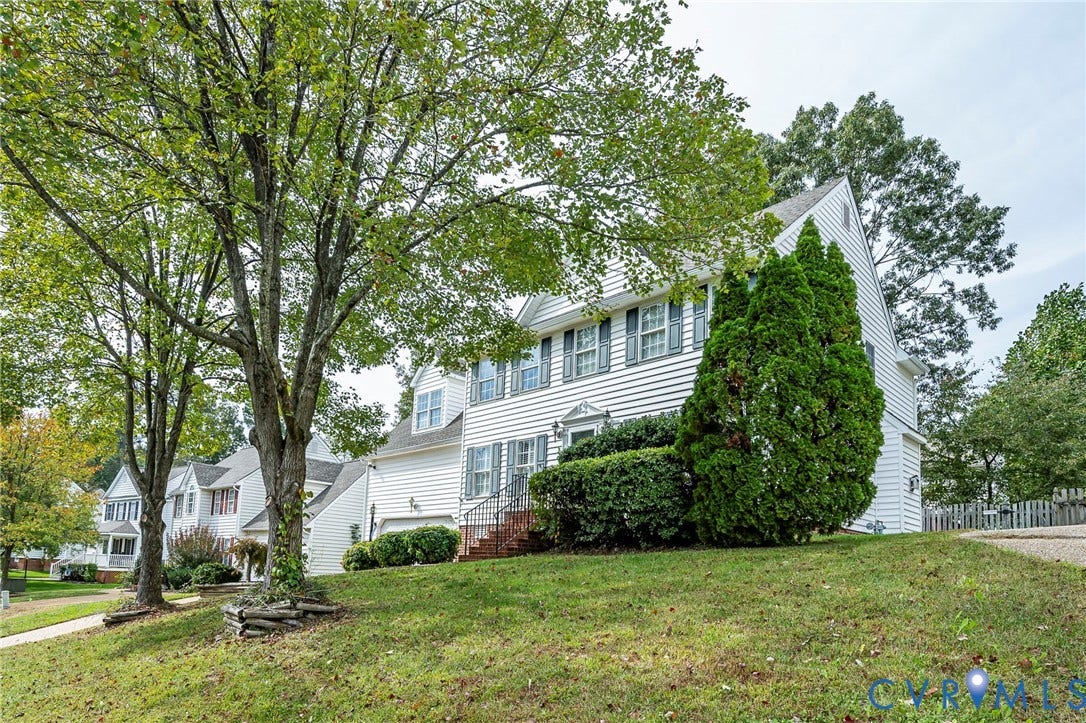 11821 Park Forest Way, Glen Allen, VA 23059 Two-story residence featuring white siding and light blue window shutters