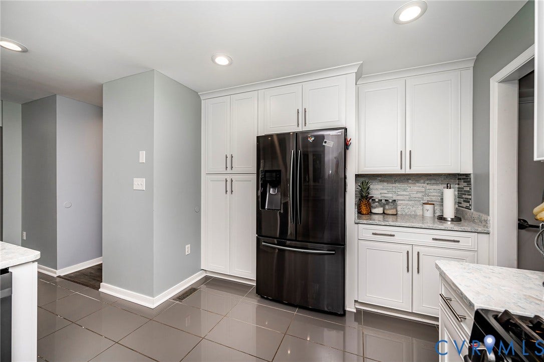 11821 Park Forest Way, Glen Allen, VA 23059 Kitchen featuring white shaker-style cabinetry, a tile backsplash, light-colored countertops, recessed lighting, and large format floor tiling