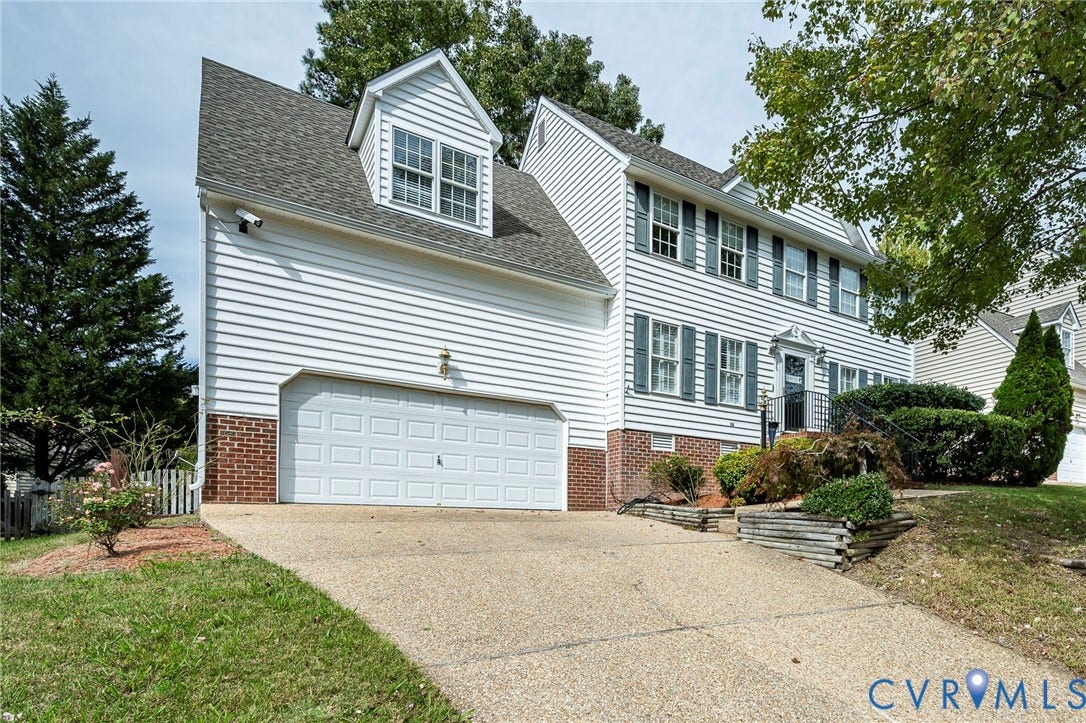 11821 Park Forest Way, Glen Allen, VA 23059 Two-story residence featuring white siding, a two-car garage, and a dormer window