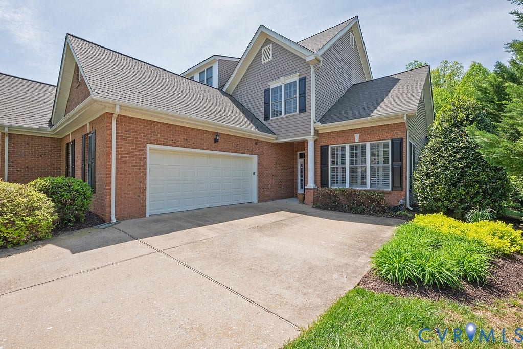 3485 Manor Grove Circle, Glen Allen, VA 23059 Brick and siding exterior featuring a multi-car garage, shuttered windows, and a concrete driveway