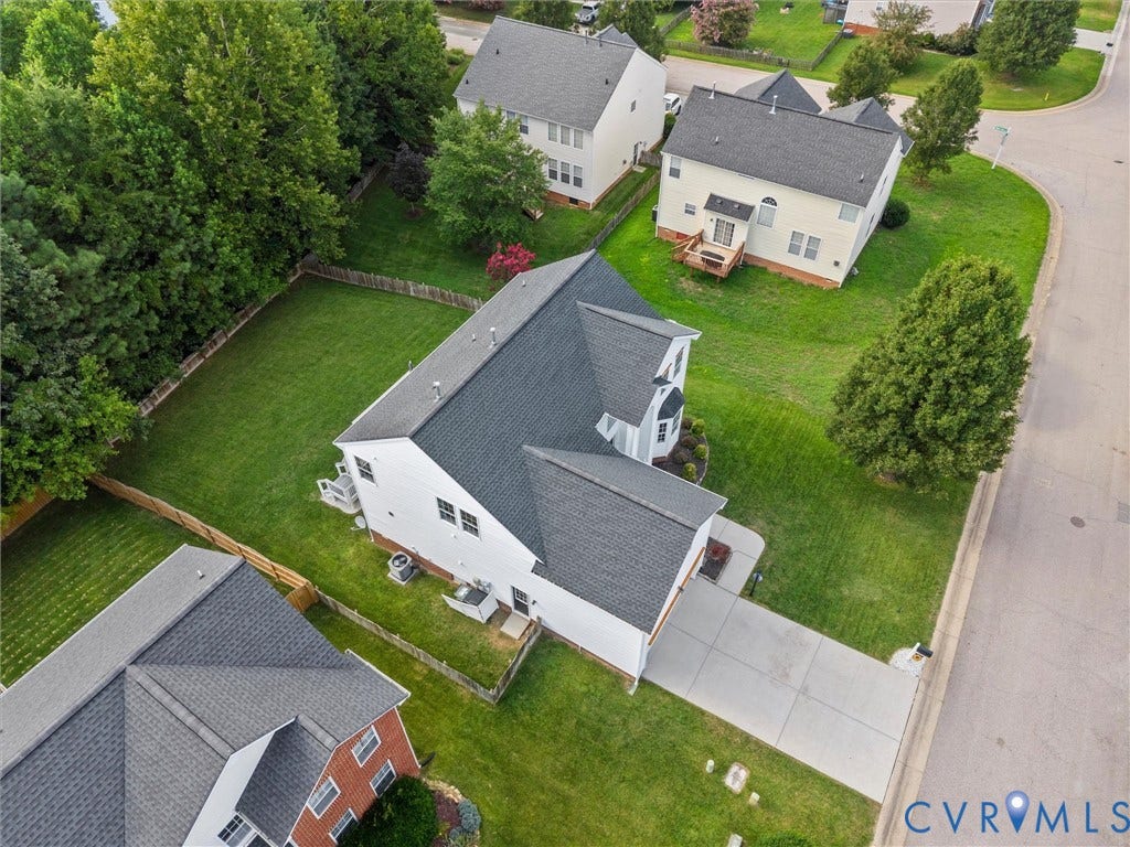 2606 Water Race Terrace, Watermill, Midlothian, VA 23112 Aerial perspective showcasing a property with a concrete driveway, a large rear yard, and a shingled roof
