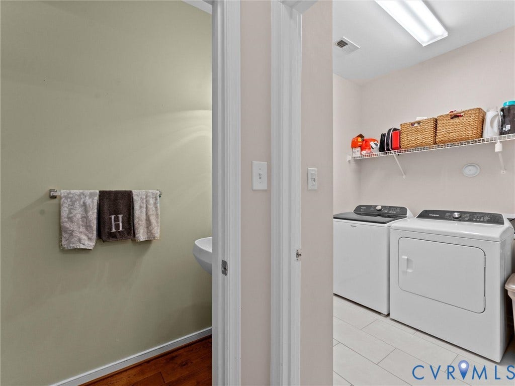 2606 Water Race Terrace, Watermill, Midlothian, VA 23112 Dedicated laundry area with white appliances, overhead wire shelving, and wood-finish flooring