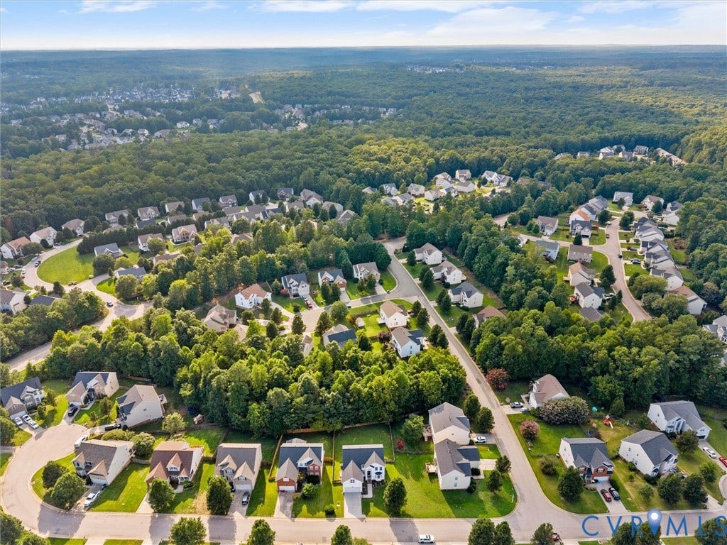2606 Water Race Terrace, Watermill, Midlothian, VA 23112 Aerial perspective showcasing a residential community amidst extensive wooded areas