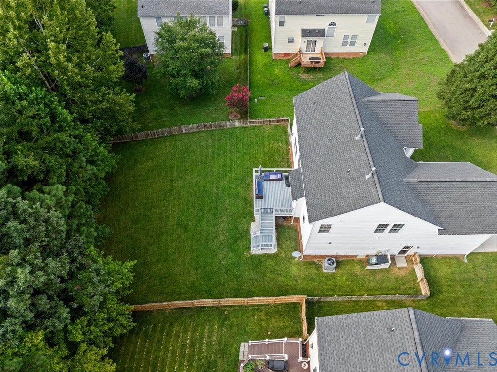 2606 Water Race Terrace, Watermill, Midlothian, VA 23112 Spacious backyard featuring a manicured lawn, full privacy fencing, and a multi-level deck with stairs