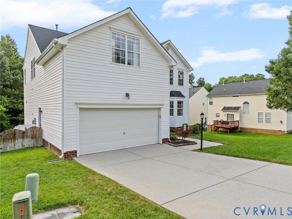 2606 Water Race Terrace, Watermill, Midlothian, VA 23112 White siding exterior with a two-car garage