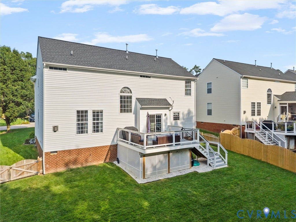 2606 Water Race Terrace, Watermill, Midlothian, VA 23112 Rear exterior featuring a multi-level deck with white railings, a sliding glass door, and an arched window