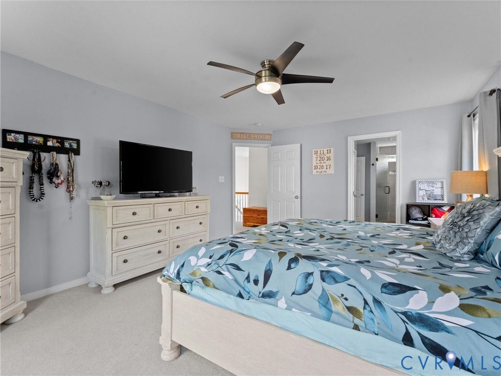 2606 Water Race Terrace, Watermill, Midlothian, VA 23112 Carpeted bedroom featuring light gray wall paint, a ceiling fan with integrated lighting, and a white interior door