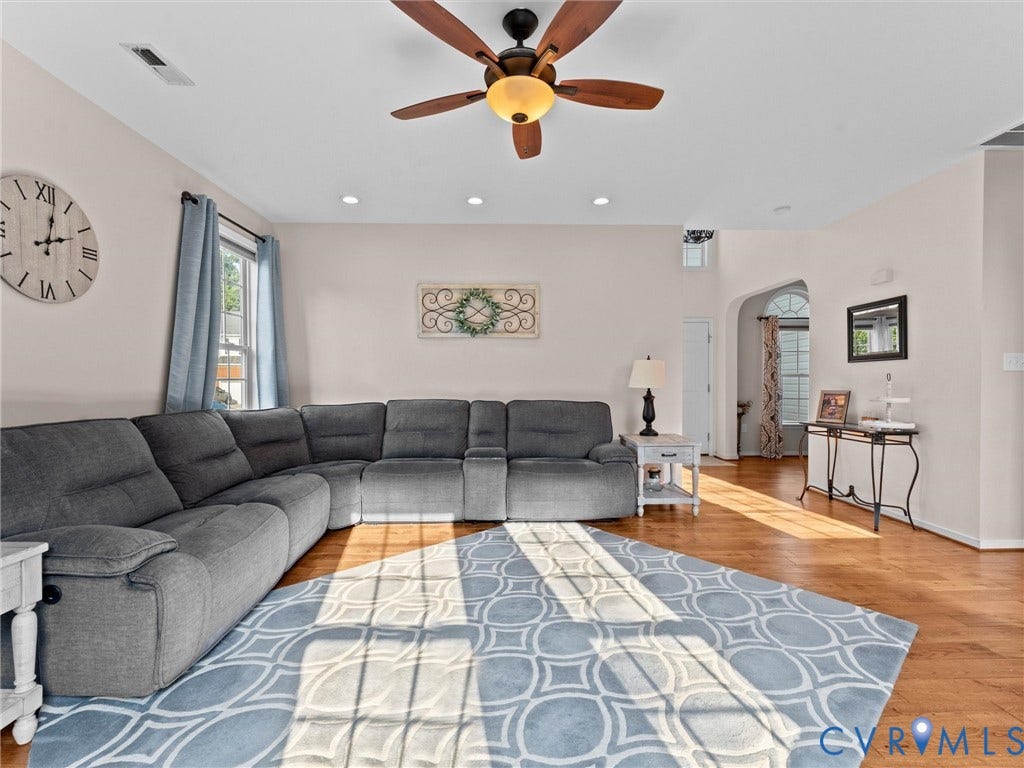 2606 Water Race Terrace, Watermill, Midlothian, VA 23112 Bright living area featuring wood-finish flooring, recessed lighting, and a ceiling fan with light fixture