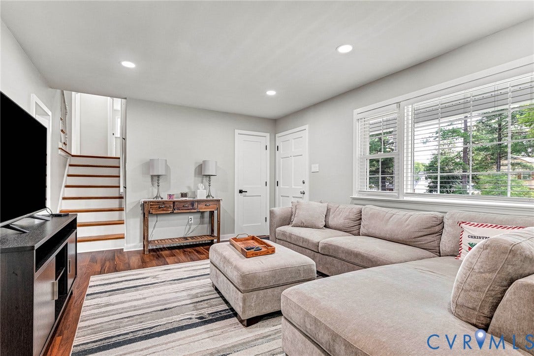 8318 Lydell Drive, Henrico, VA 23228 Recessed lighting, wood-finish flooring, white paneled doors, and a staircase with wood treads