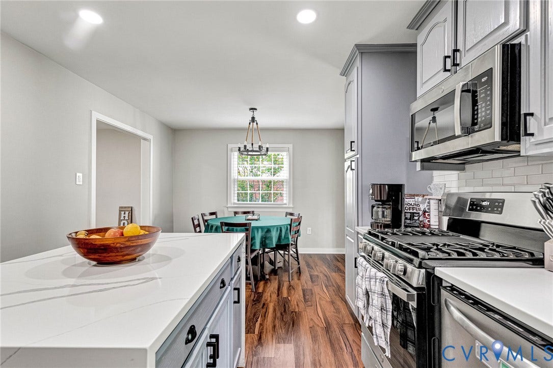 8318 Lydell Drive, Henrico, VA 23228 Kitchen featuring a gas range, stainless steel appliances, and white subway tile backsplash