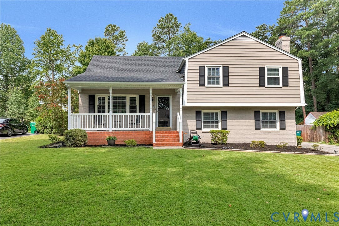 8318 Lydell Drive, Henrico, VA 23228 Split-level residence featuring a covered front porch with white railings, a brick foundation, and light-toned siding