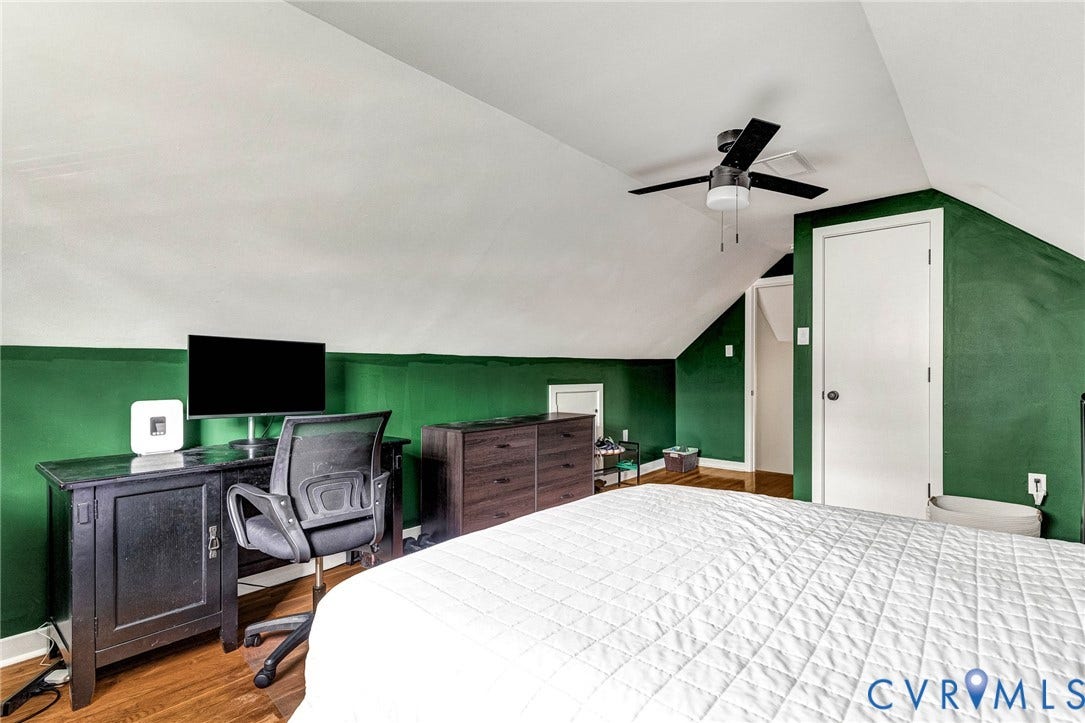 8318 Lydell Drive, Henrico, VA 23228 Sloped ceilings with a ceiling fan, wood-finish flooring, and a built-in recessed wall panel