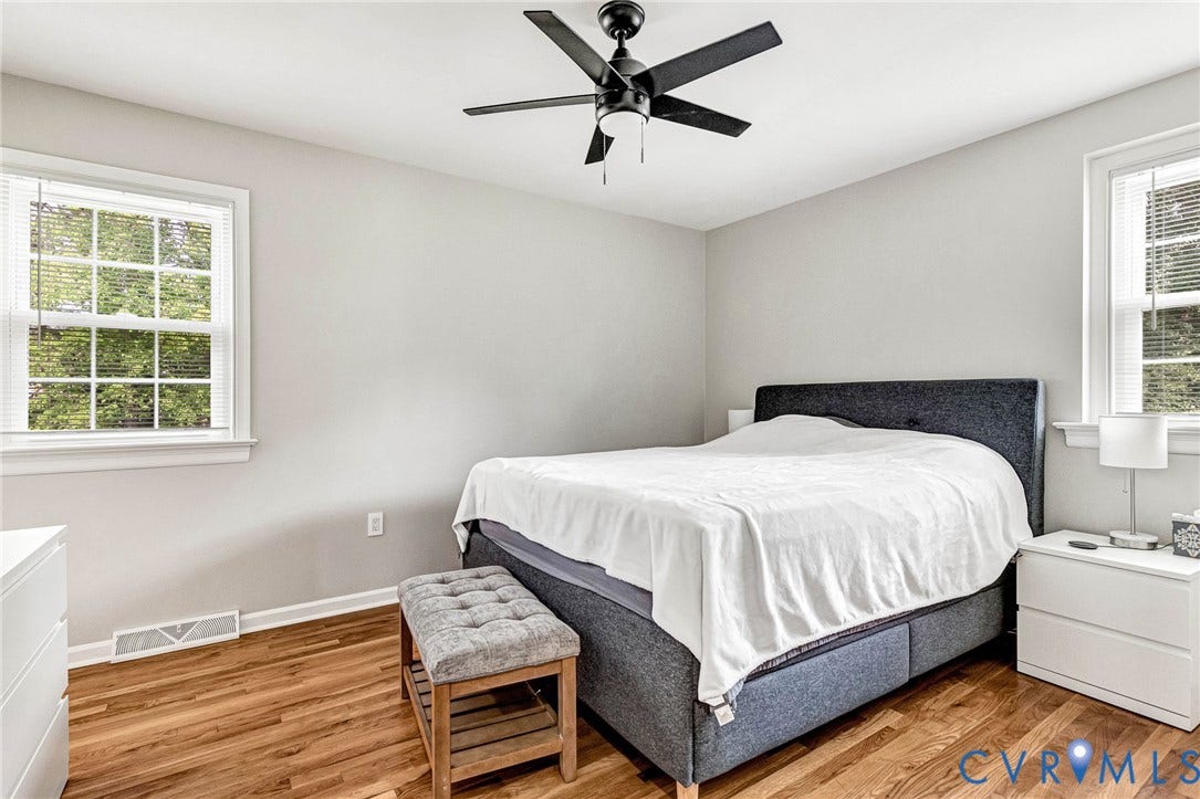 8318 Lydell Drive, Henrico, VA 23228 Wood-finish flooring, white walls, and a black ceiling fan with integrated lighting