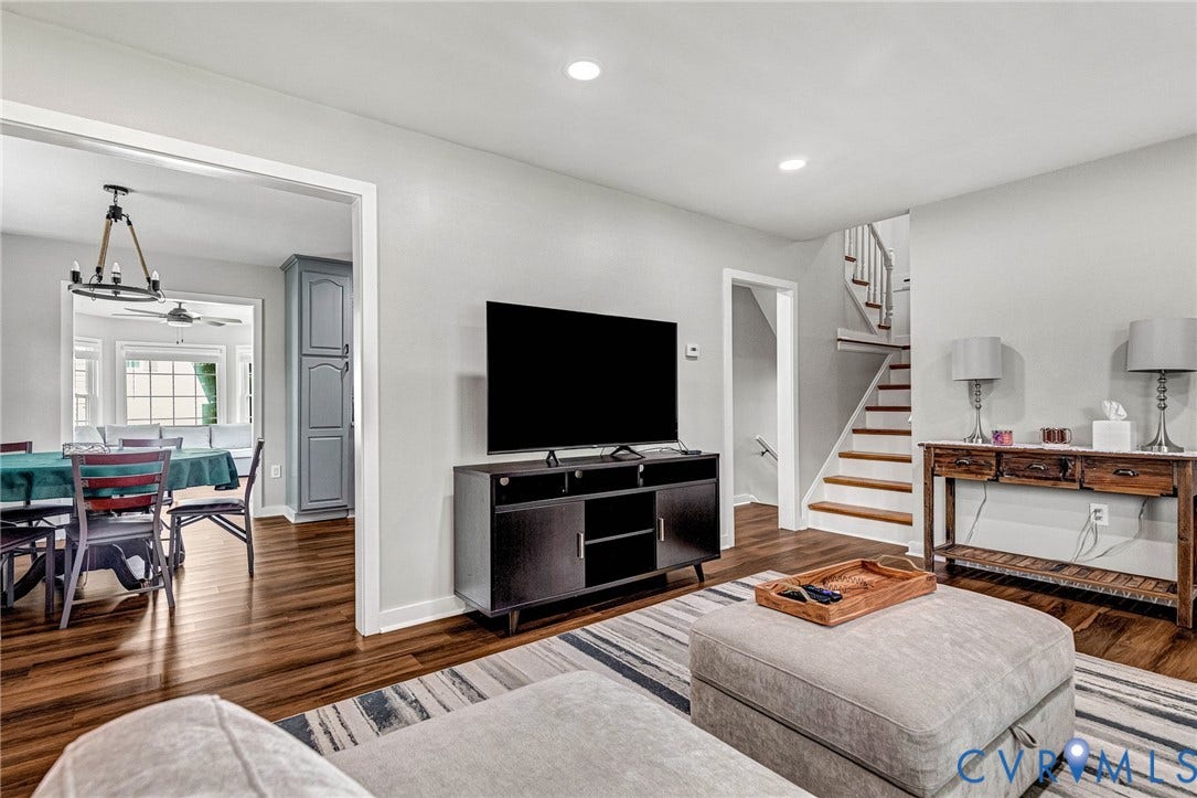 8318 Lydell Drive, Henrico, VA 23228 Wood-finish flooring throughout, recessed ceiling lighting, a built-in storage cabinet, and a staircase with wood treads