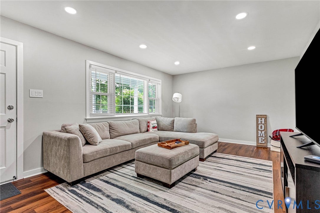 8318 Lydell Drive, Henrico, VA 23228 Recessed ceiling lighting, wood-finish flooring, white trim, and a window with blinds