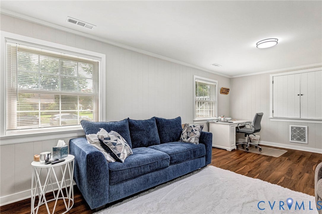 8318 Lydell Drive, Henrico, VA 23228 Wood-finish flooring, white paneling, ceiling-mounted light fixture, and window with blinds