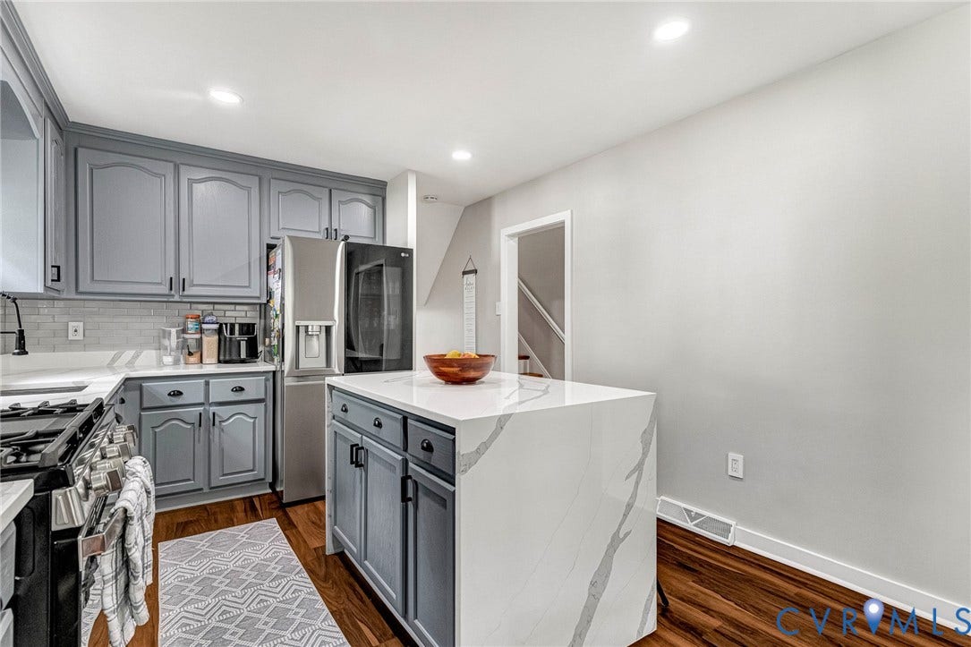 8318 Lydell Drive, Henrico, VA 23228 Waterfall island, light gray cabinetry, stainless steel appliances, wood-finish flooring, and recessed lighting