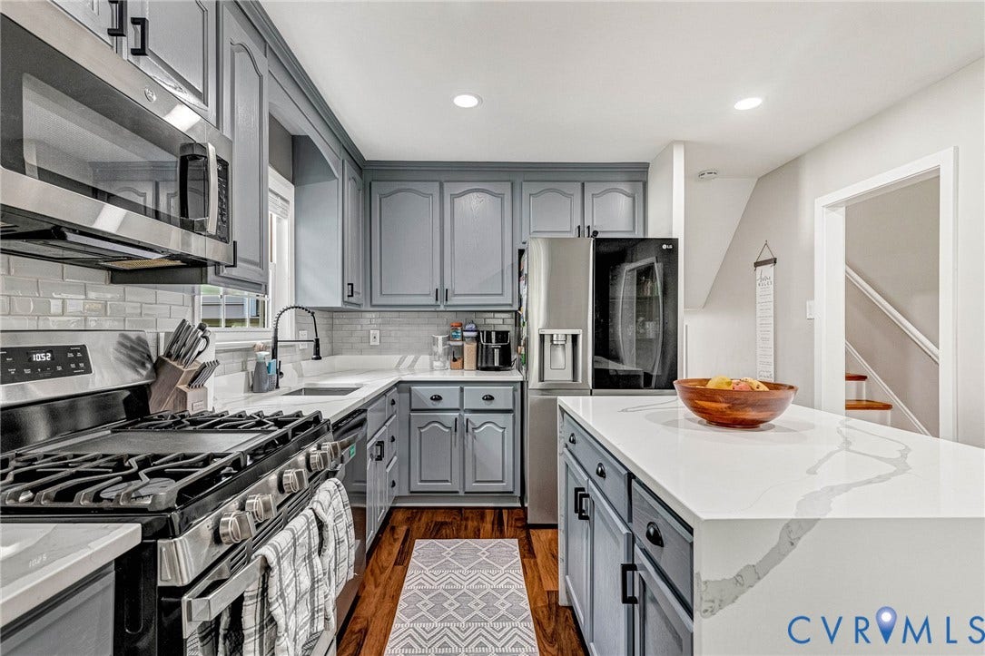 8318 Lydell Drive, Henrico, VA 23228 Full kitchen featuring gray cabinetry, stainless steel appliances, white countertops, a subway tile backsplash, and wood-finish flooring