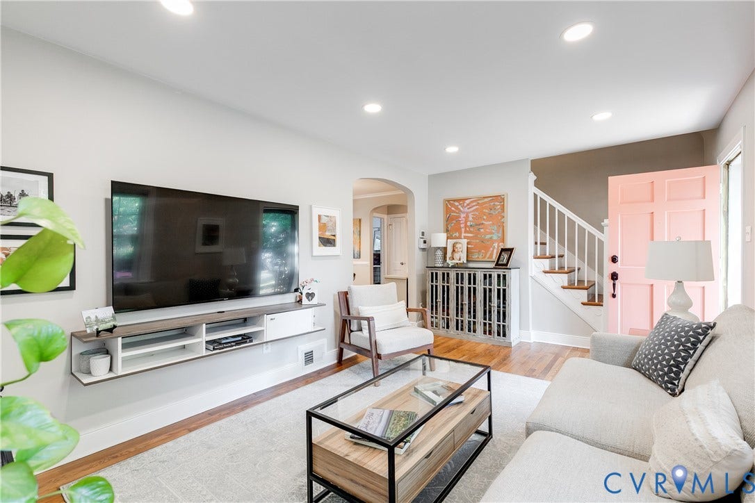 5204 Caledonia Road, Westover Hills, Richmond, VA 23225 Recessed ceiling lighting, wood-finish flooring, white staircase railing, paneled entry door, and a floating media console