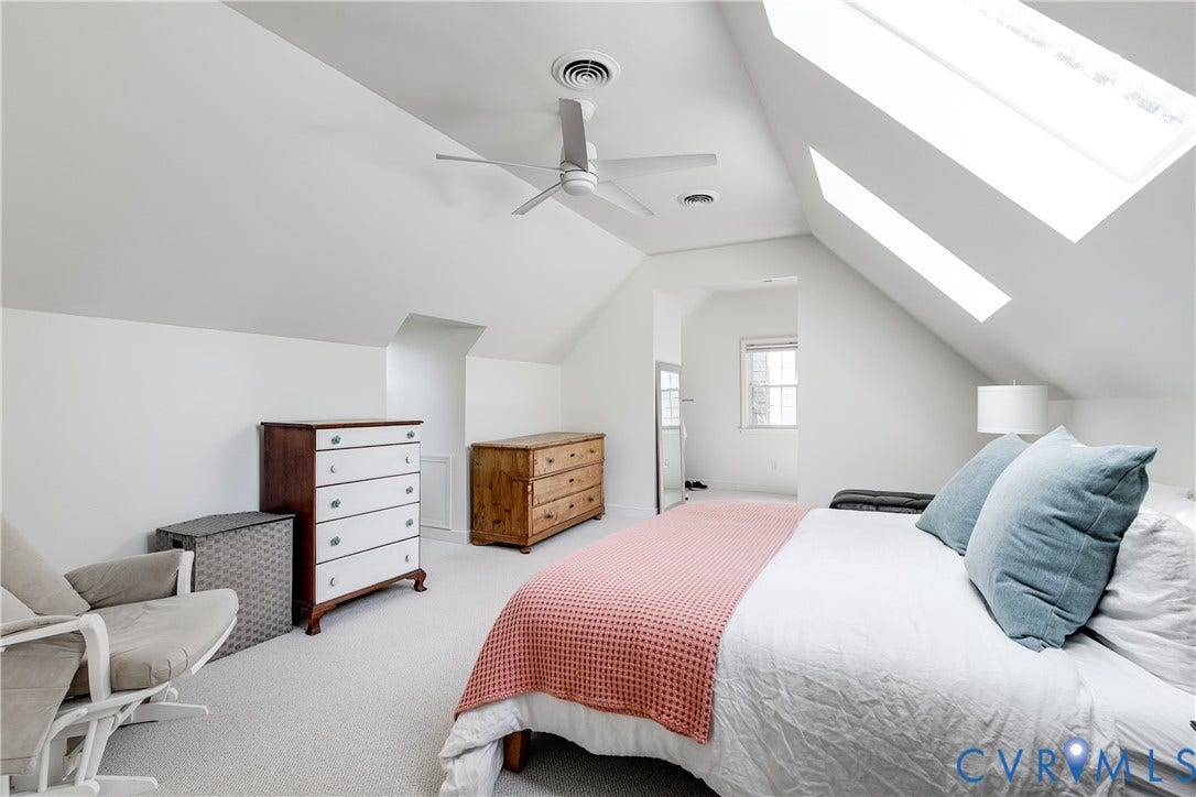 5204 Caledonia Road, Westover Hills, Richmond, VA 23225 Angled ceilings with multiple skylights, overhead ceiling fan, and light-colored carpet flooring
